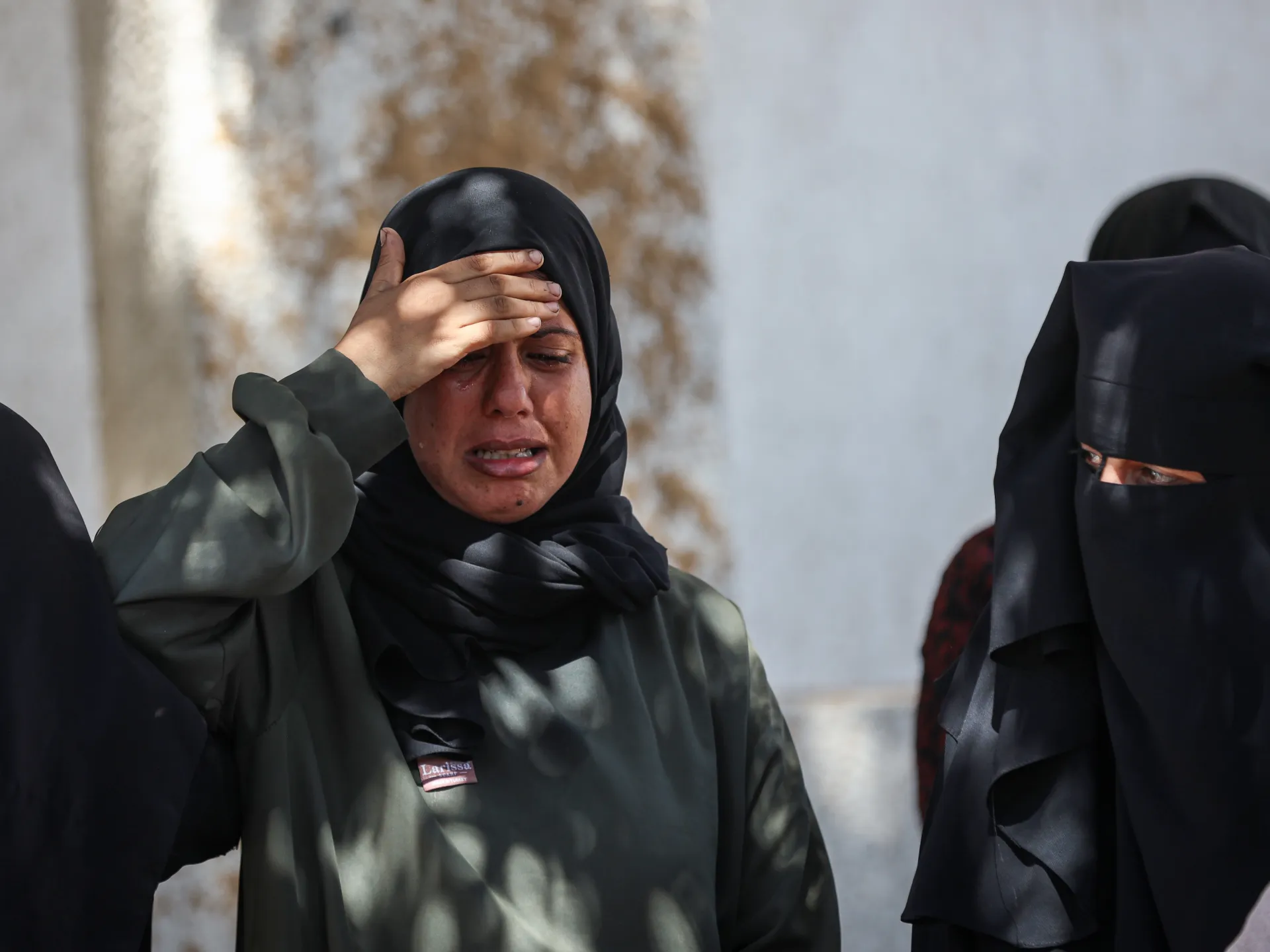 Damaged Gaza City building collapses, leaving families searching for loved ones