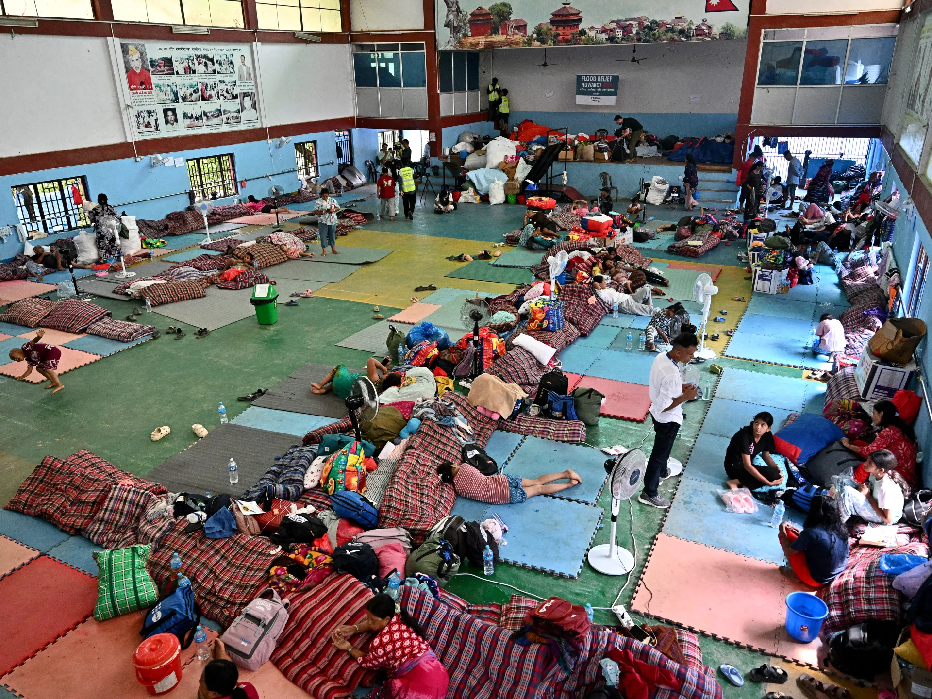 Search operations enter day 12 after floods hit China and Nepal