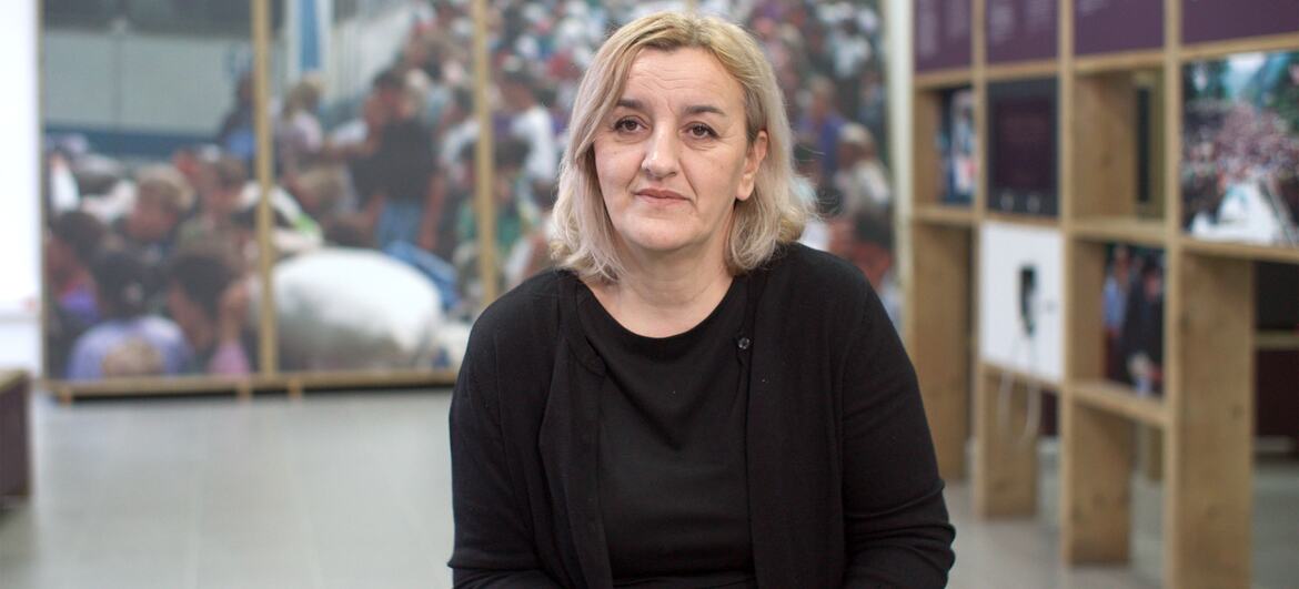 Female survivor of the Srebrenica genocide is shown during an interview inside a memorial centre.