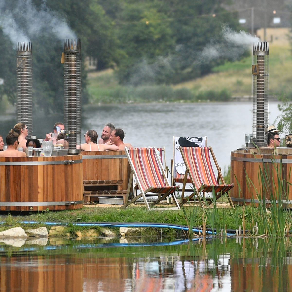 Hot tubs and £80 rosé: how the mud-soaked British festival got a luxury makeover