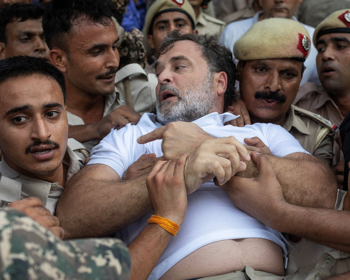 Rahul Gandhi briefly detained during large protests calling for Modi’s resignation in Delhi